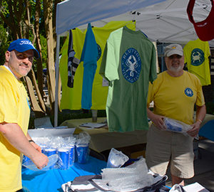 Mike Covert, President of the Bluffton Rotary Club. People in yellow t-shirts