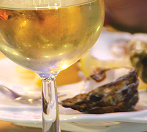 Food - Fresh from the Sea glass of wine and oysters