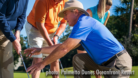 Golf Tips from Palmetto Dunes. man helping a golfer with his swing