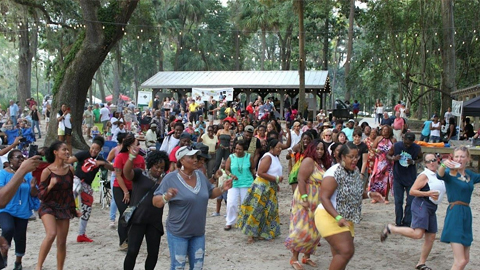 Reggae Pon De River Music Festival. people outdoors dancing