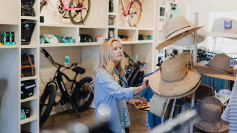 Outside Palmetto Bluff. a woman in a blue shirt who appears to be shopping