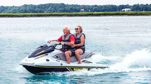 Everything You Need to Know Before Retiring in Bluffton. a couple on a jet ski